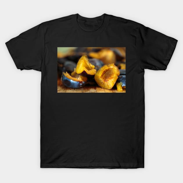 Plums sliced on a wooden board T-Shirt by naturalis